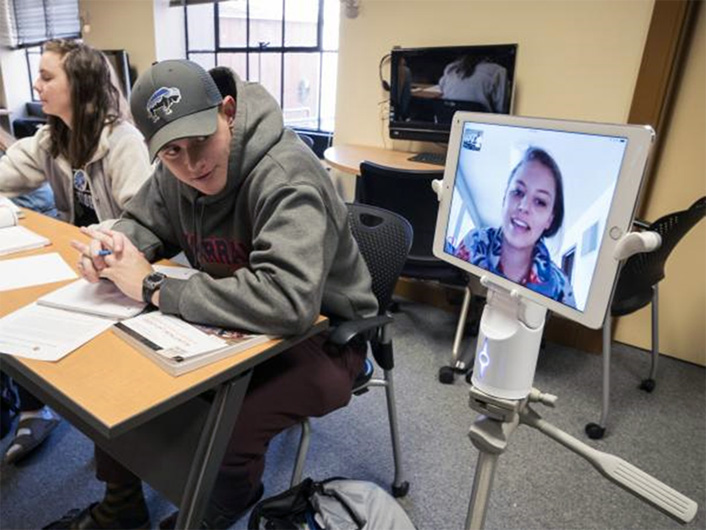 A pilot study participant attending class via the Kubi telepresence system (photo by Glenn Asakawa, University of Colorado)